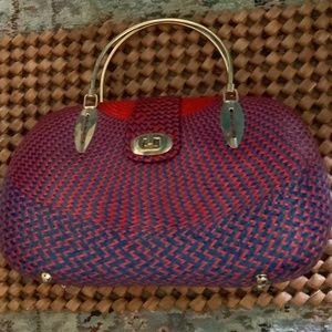 Handbag strawlike red & navy blue brass handles .